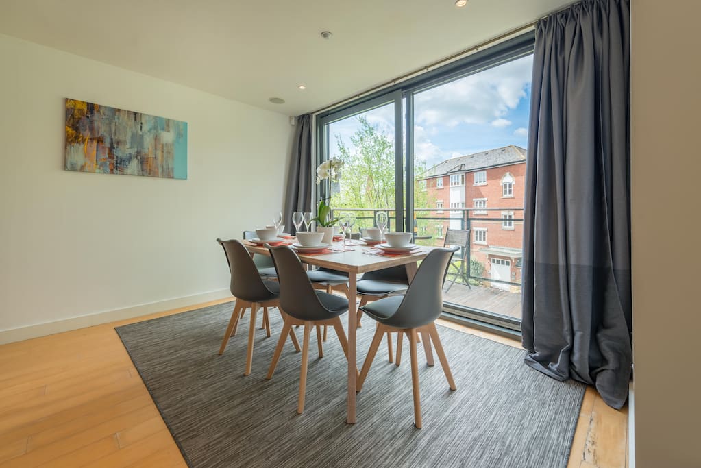 Dining area next to balcony overlooking the stream below,