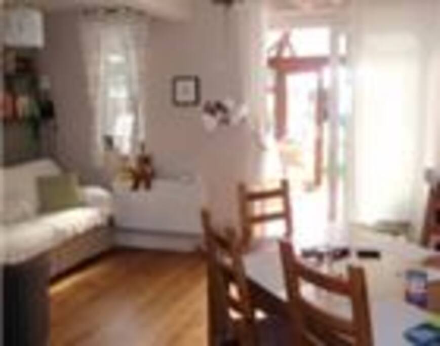 The living room is opened up with the kitchen and it is the heart of the house. It has an oak floor, a sofa bed and up to 3 armchairs. The living room opens to the conservatory. TV provided.