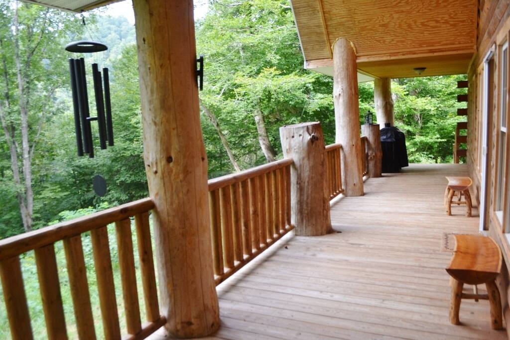A beautiful porch area is perfect for morning coffee and enjoying nature.