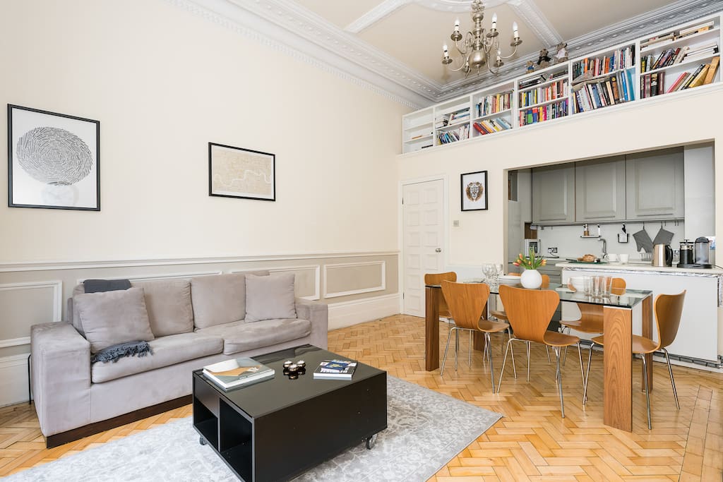 Large dining table, a library, and comfy sofa for TV watching