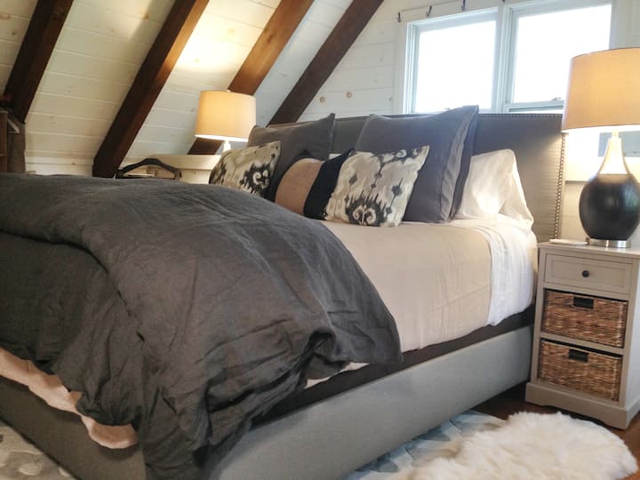 Super romantic king bedroom, with gel memory foam mattress, Matteo linen sheets, and shearling for your toes! I can't tell you how many guests say it was the best nights sleep they ever had...