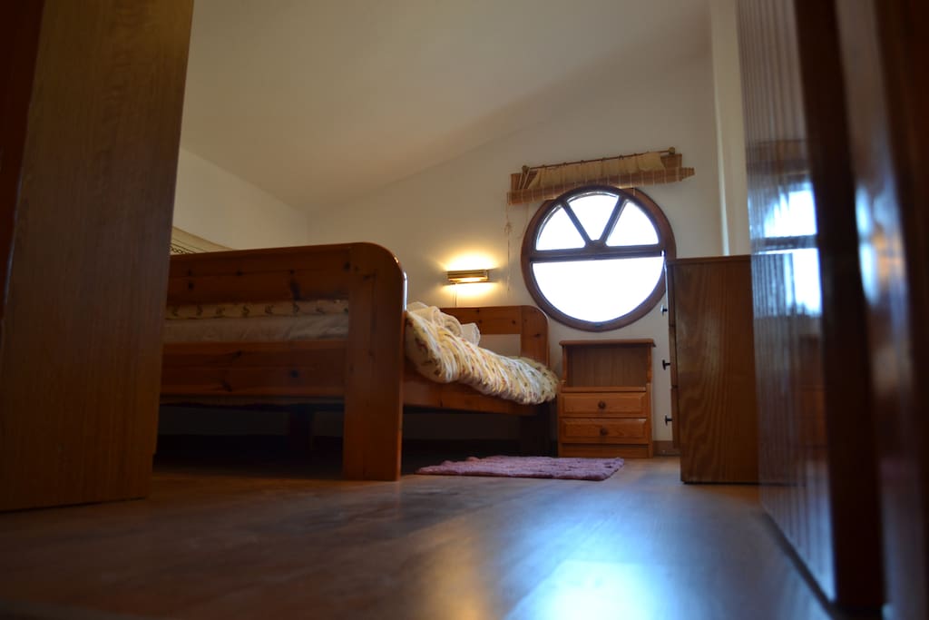 Attic bedroom with warm wooden floor