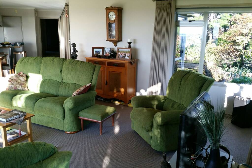 TV and kitchen leading to bedrooms