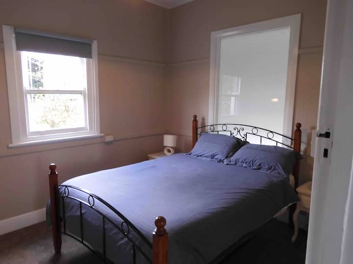 Main bedroom with robe and dress mirror