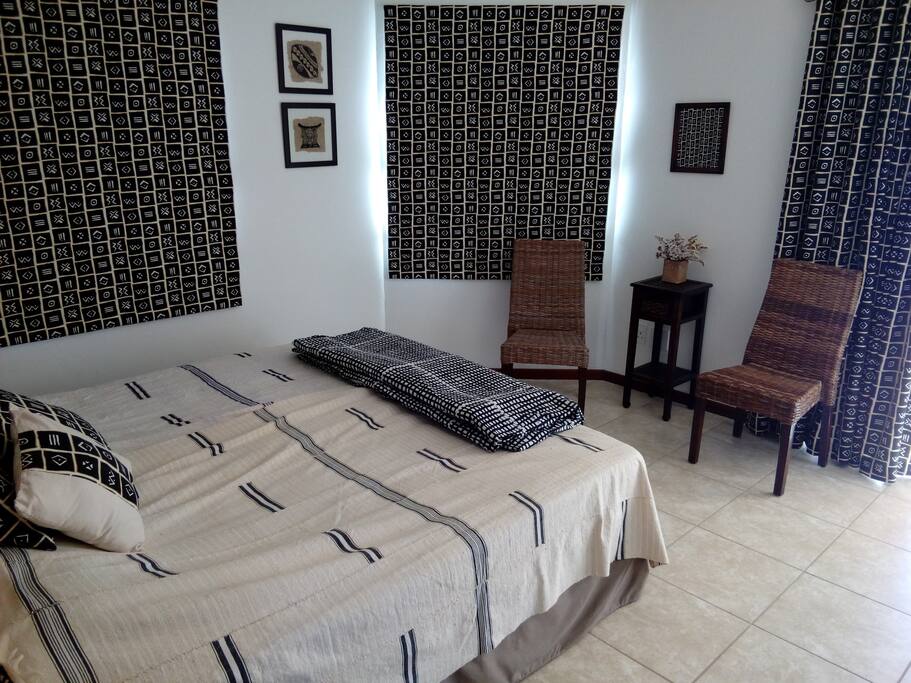 Downstairs double bedroom with own bath room. Sliding doors opening onto patio with pool and braai area, overlooking the dam.
