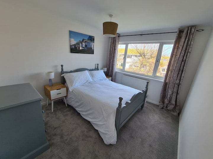 Relax and enjoy your sleep in a double bed bedroom with an Emma Mattress. Sea can be seen from this bedroom. 