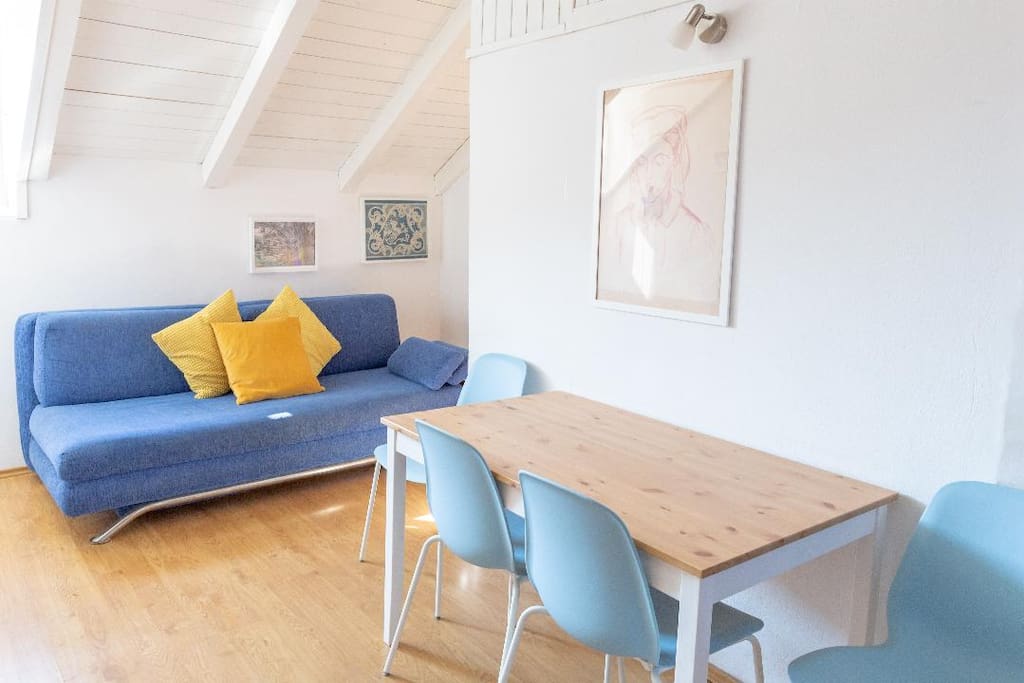 Dining/living room with sat TV and fold-out sofa