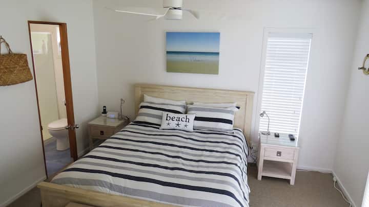 New comfy King bed with ensuite bathroom, TV, phone, outdoor access and sea views