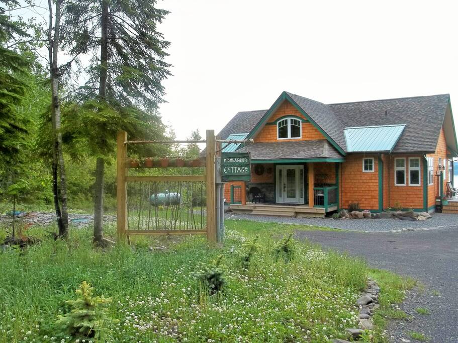 Back side of cottage with side deck.
