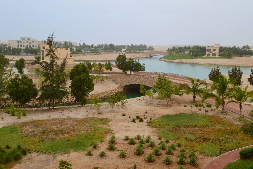 The view from the balcony to the lagoons, gardens and sea beyond