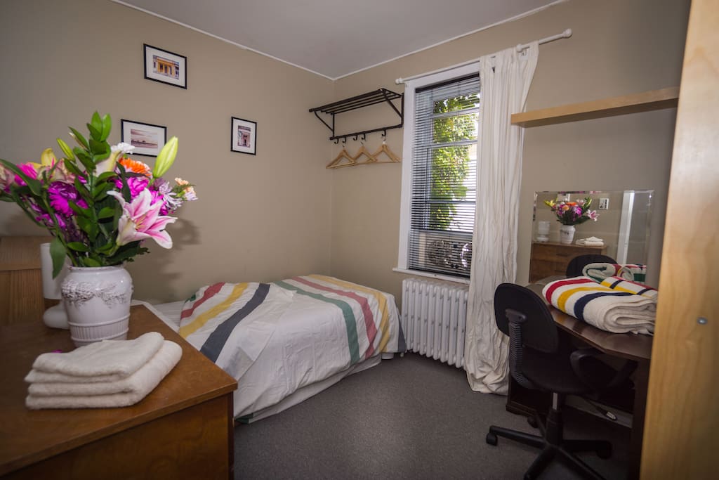 The single room has a desk and a view towards the river