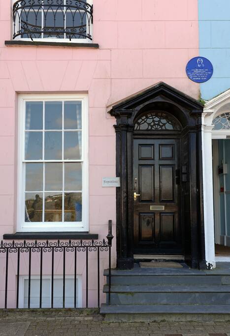 Heritage plaque showing George Eliot wrote her first novel in the building