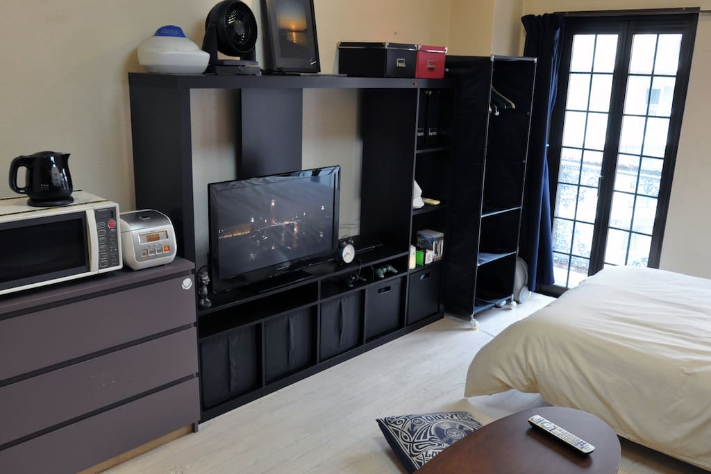 32 inch TV, microwave oven, kettle.