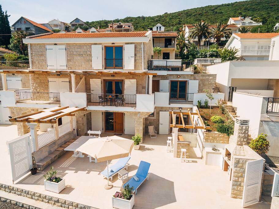 3 bedroom semi detached villa with private beach and sun bathing area, private parking, sauna, and barbeque
