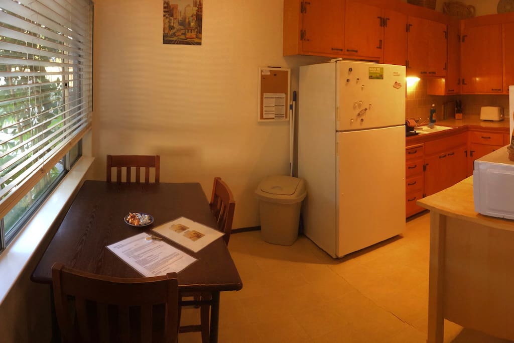 Eat-in kitchen with seating for 4+. Full-size refrigerator.