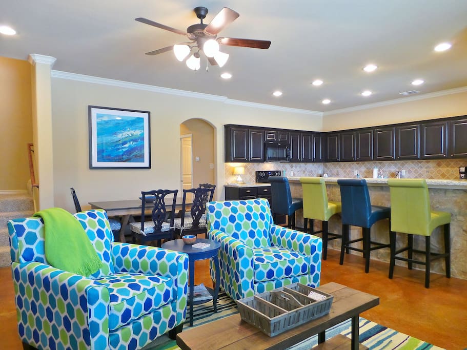 The open floor plan features a living room, dining area, and kitchen!