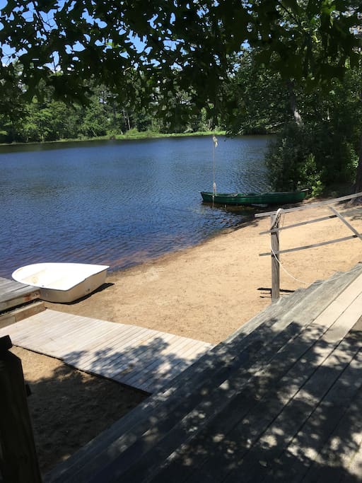Sandy beach, dock, boats