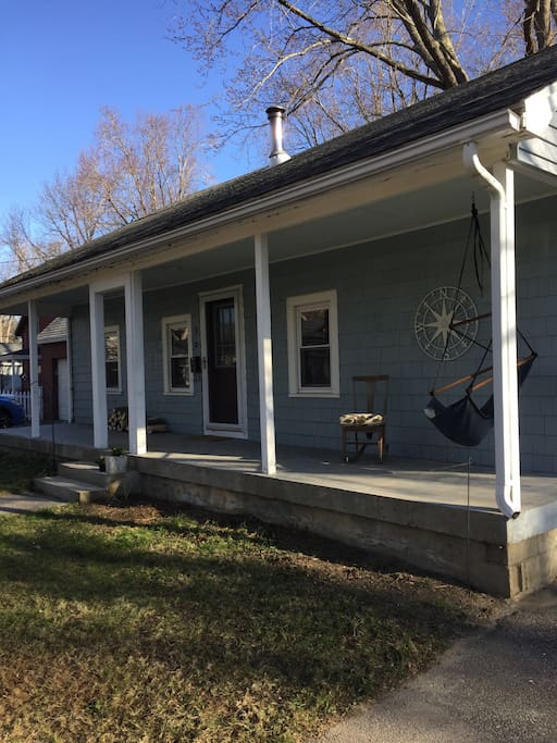Long front porch ready for you to enjoy morning coffee or an evening cocktail. Established gardens of perennials are just about to emerge for the season.