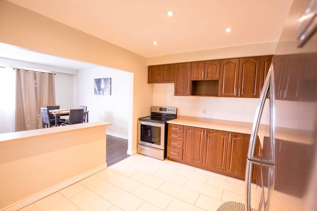 Large, Spacious Kitchen (Stocked with basic cooking needs) - Comes with Microwave & Fridge