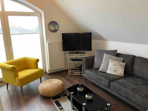 Successful Airbnb property: Central & cozy attic apartment with sea view balcony in Norden