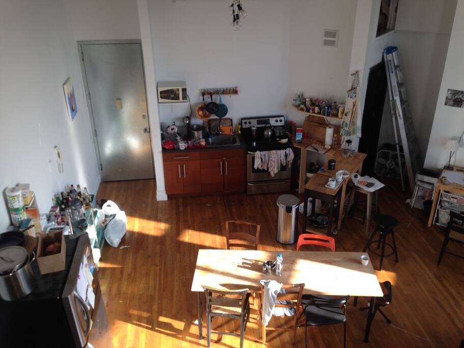 aerial view of kitchen from top of stairs