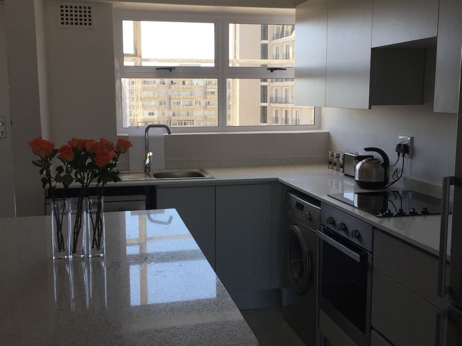 open plan kitchen with all mod cons