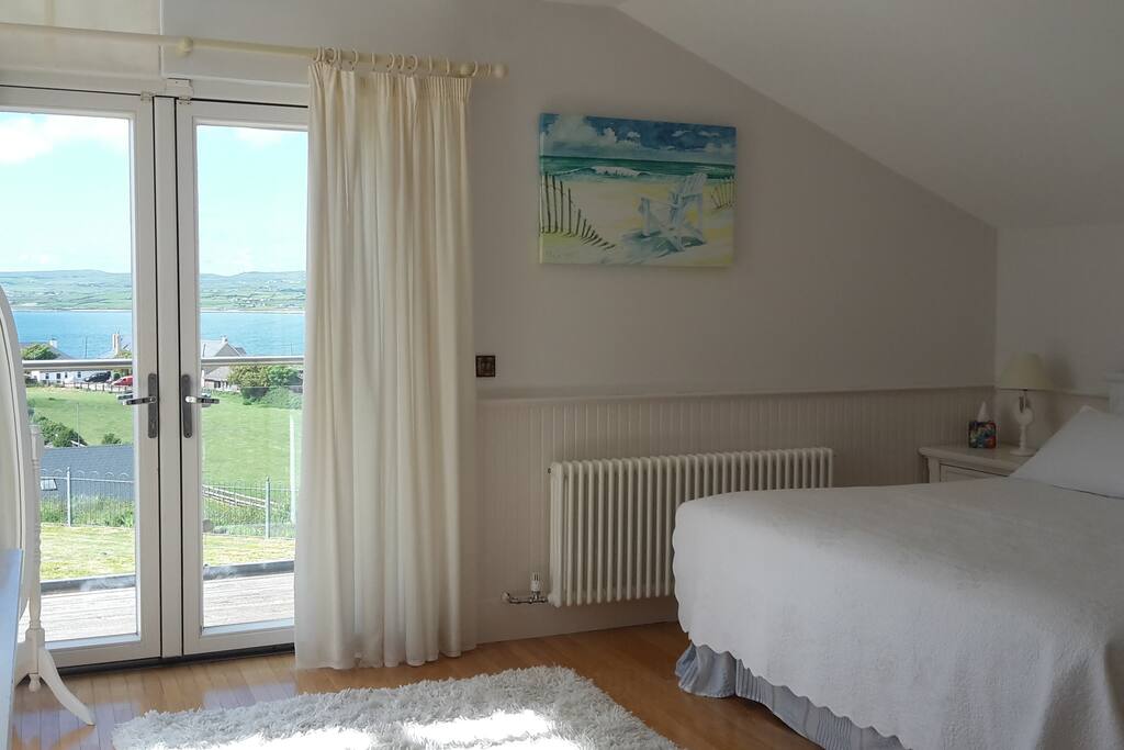 Master bedroom with en-suite and balcony over looking the sea.