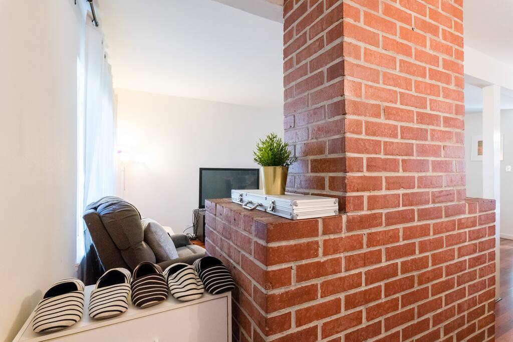 Living room with a recline sofa, a futon that can be convert to a twin ,a recline chair, fireplace and TV