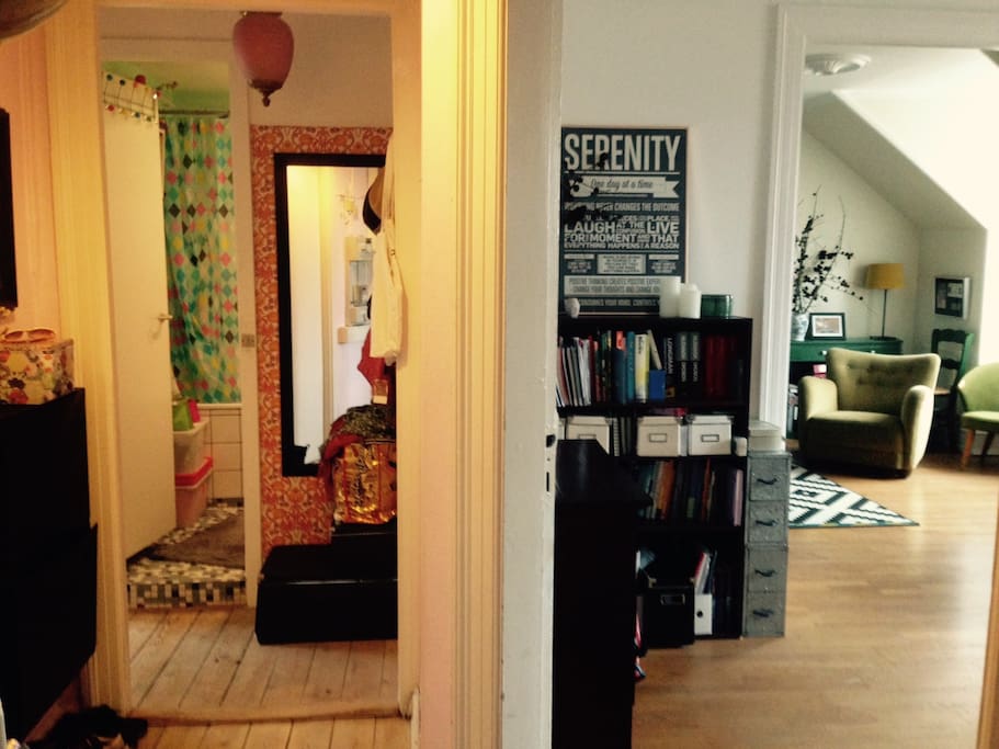Glimpse of the bathroom/entrance hall to the left and of the two rooms en suite to the right.