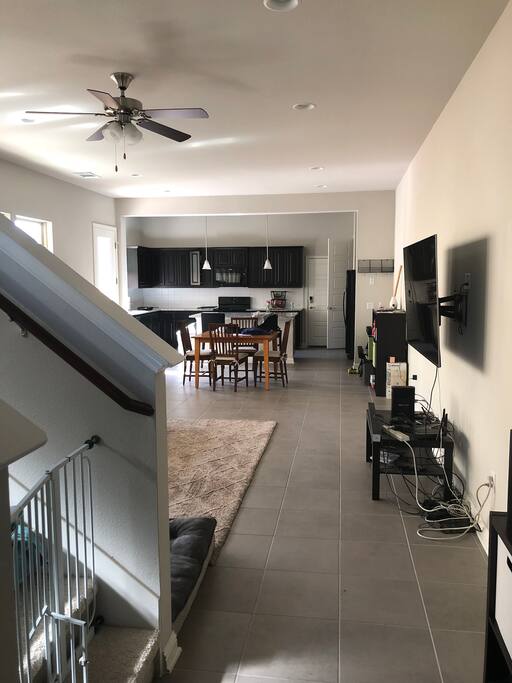 This is entry view. Stairs on the left and a gate to block the dog from going upstairs.