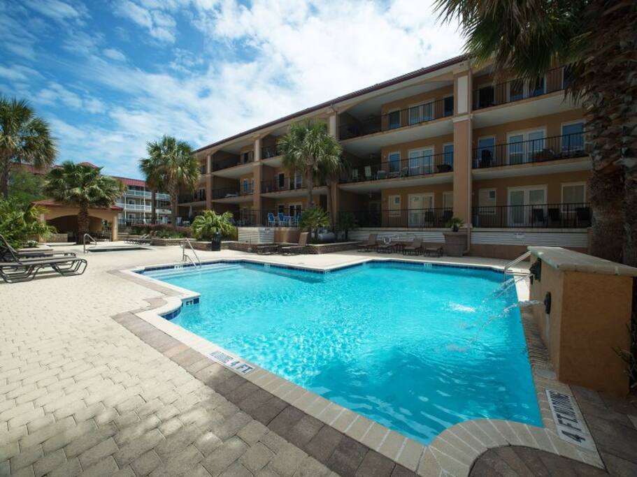 Enjoy the Swimming Pool and Spa with Abundant Deck Space, Lounge Chairs and Shaded Cabana