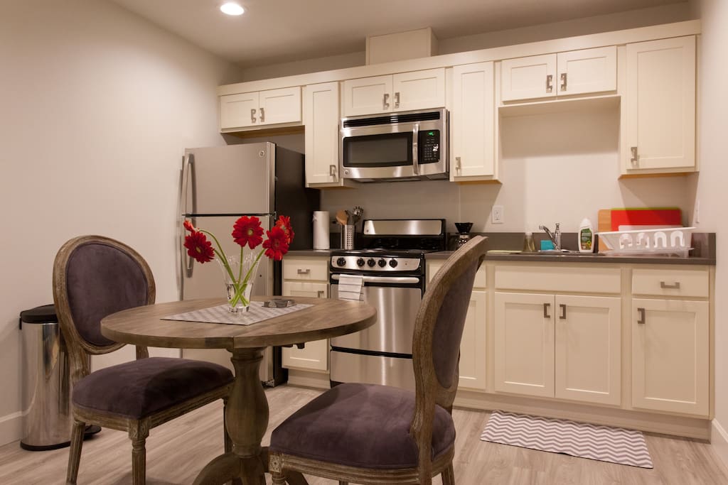 Lovely kitchen with full size fridge, oven, range, microwave, and fully equipped with pots, pans, bakeware, utensils, etc.
