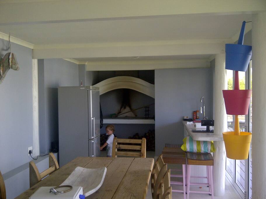 Indoor braai equipped with kitchenette with a dishwasher and fridge, as well as downstairs toilet