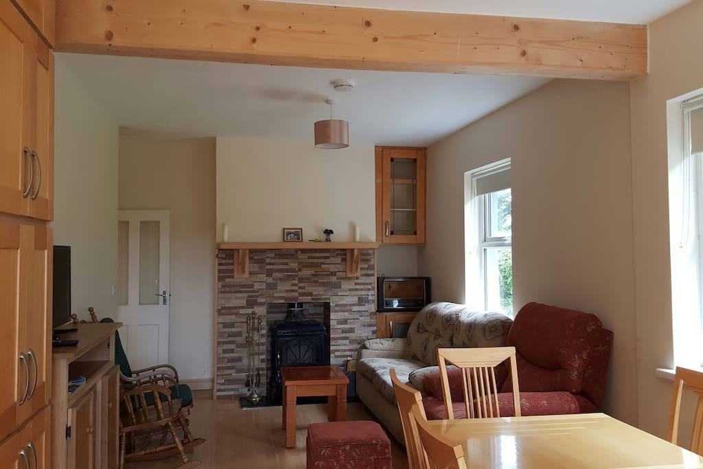 Living area with stove and comfy furnishings