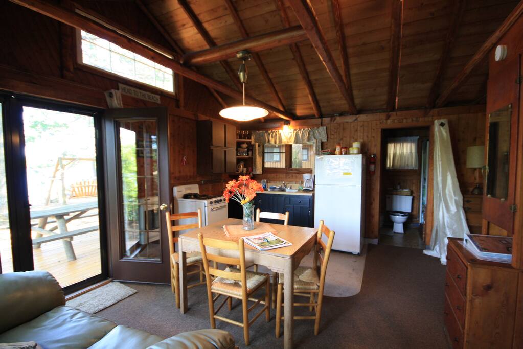 Open beam exposed log/knotty pine interior w/equipped kitchen