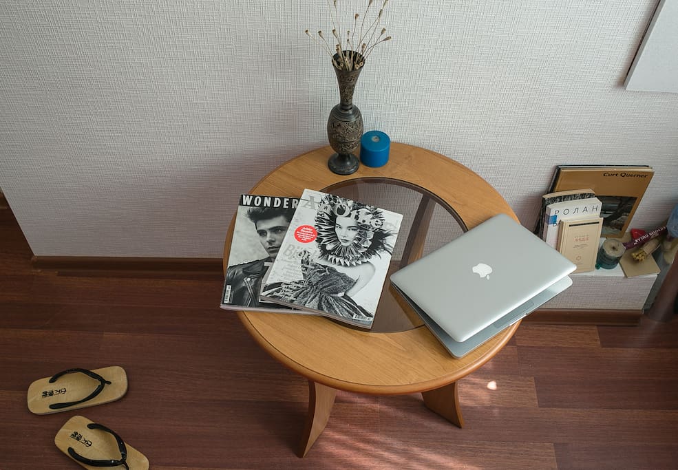 in the living room you can find fashion magazines and art books