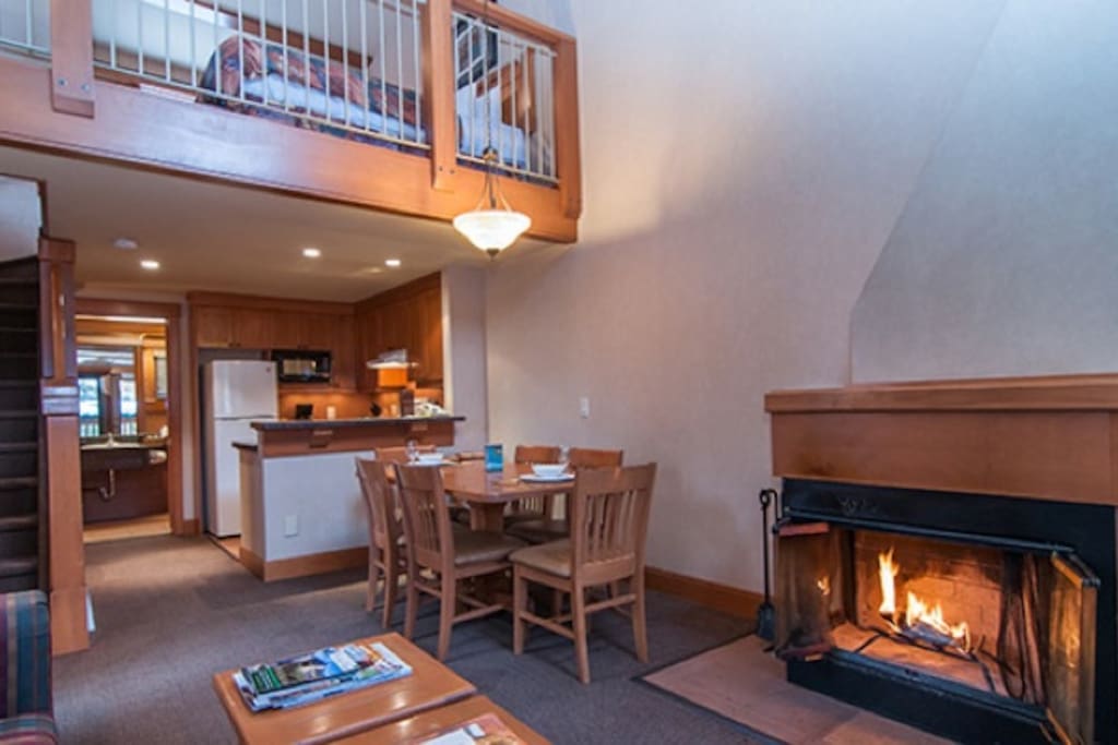 Relax with friends or family by the wood-burning fireplace in the spacious living area