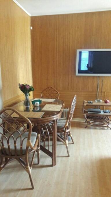 bedroom with dinner table and led t.v