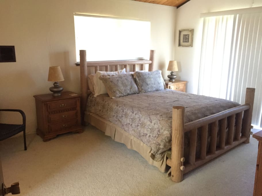 Master bedroom with private deck overlooking golf course