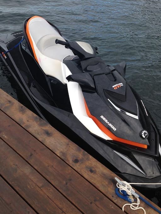 Rental jet ski docked out front on marina