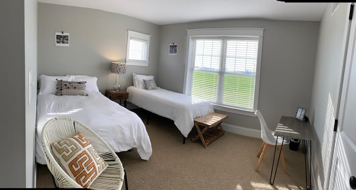 This bedroom has a double bed and a single bed.