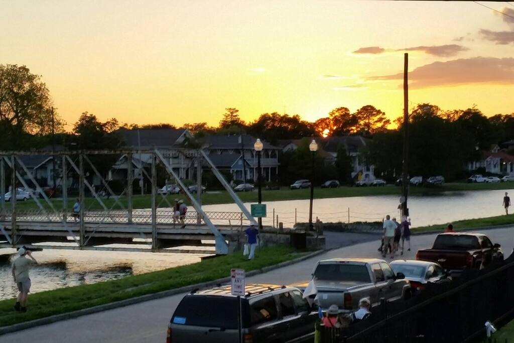 Lots of activities are happening on Bayou St. John! This view of the historic bridge was taken from our front porch in the evening.