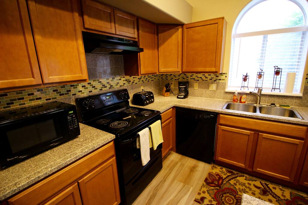 The kitchen. Complete with all the appliances and cookware to prepare a nice meal.