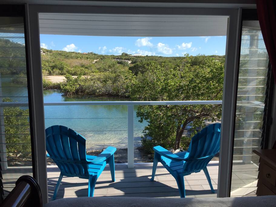 Enjoy a fresh cup of coffee on your private deck, overlooking the canal. You might just spot a turtle!