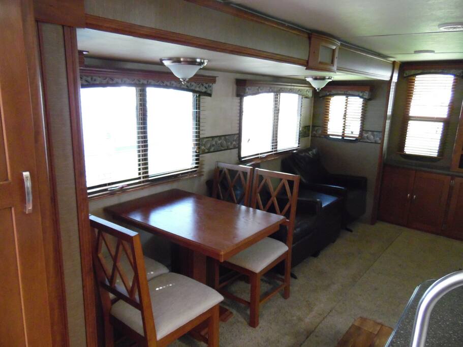 Dining table ad 2 swivel rocking chairs