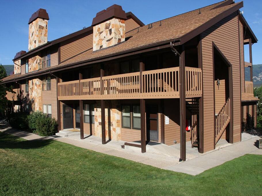 Front of building. Unit is on the lower level in the center of the building.
