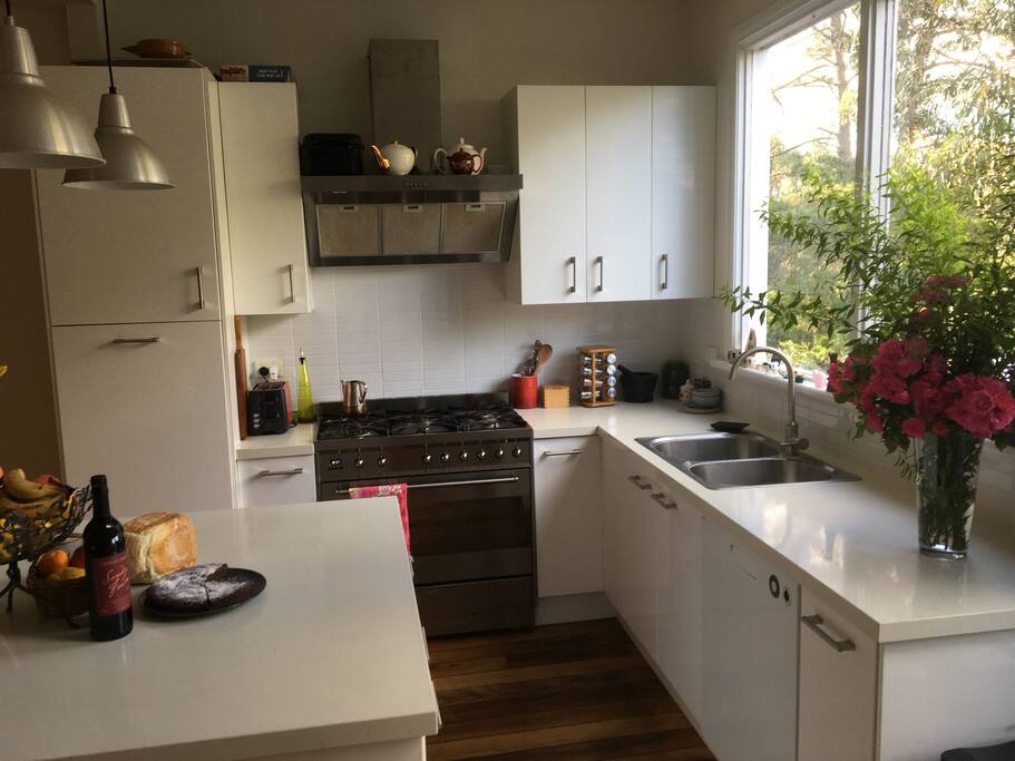 The kitchen including double oven and six burner stove.