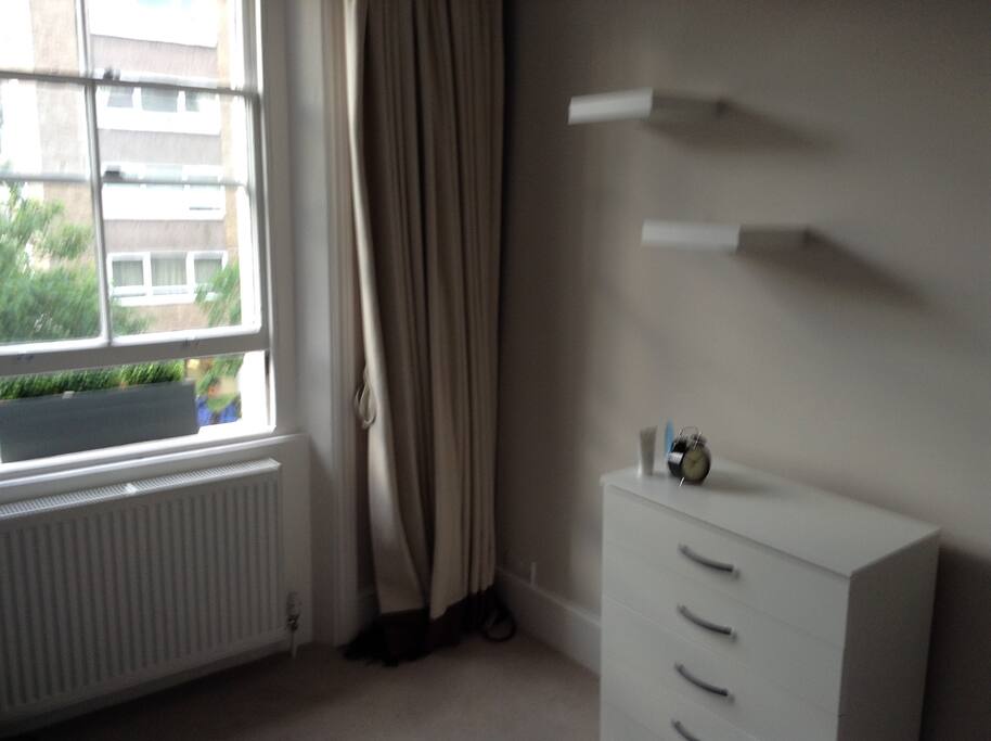 Bedroom with chest of drawers and wardrobe