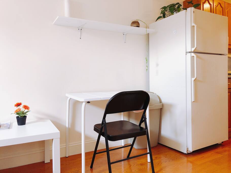 Desk and Chair in the Living Area with ample amount of Sunshine - Perfect for reading or browsing the Internet!