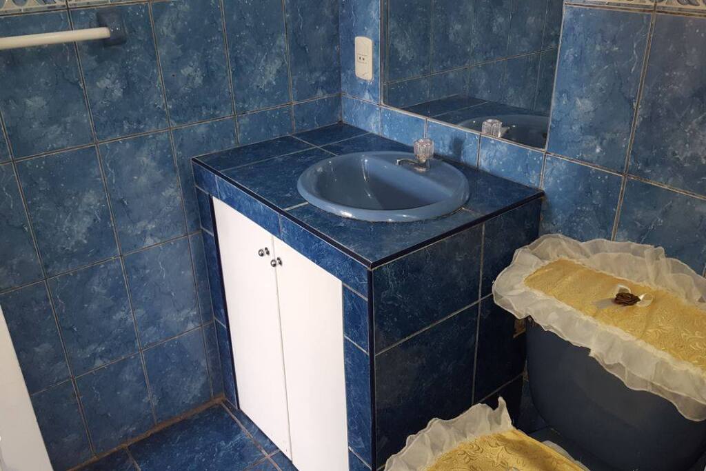 Private bathroom with hot shower.